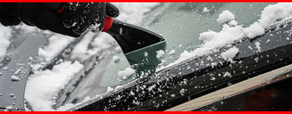 Motorist preparing to drive in snow