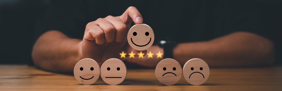 customer services best excellent business rating experience. Satisfaction survey concept. Hand of a businessman chooses a smile face on wood block cube. 5 Star Satisfaction.